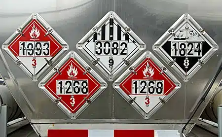 Hazardous material placards on a tanker trailer